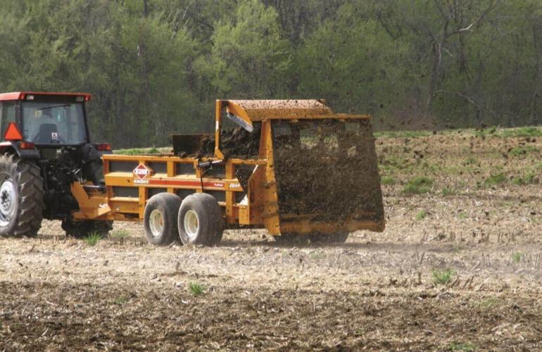 KNA spreader in action in 2004